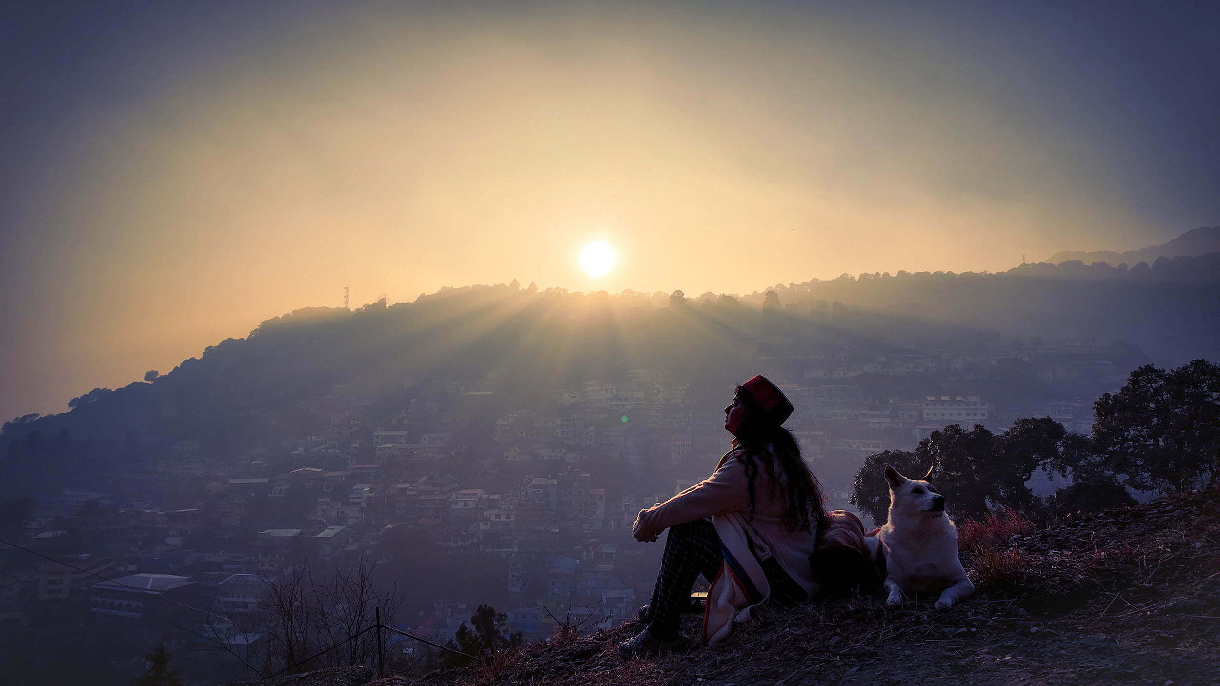 Mountain sunrise with local traveler and dog